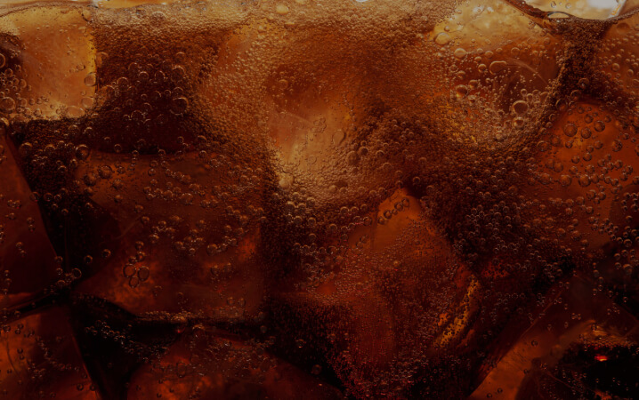 A close up shot of Jack & Coke liquid.